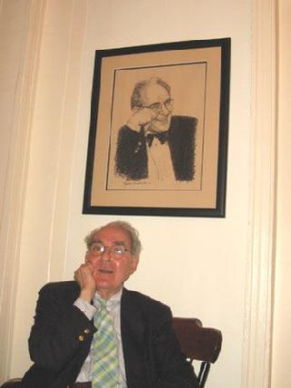 Photograph of NYT art critic Hilton Kramer sitting under his drawing by Claude Buckley